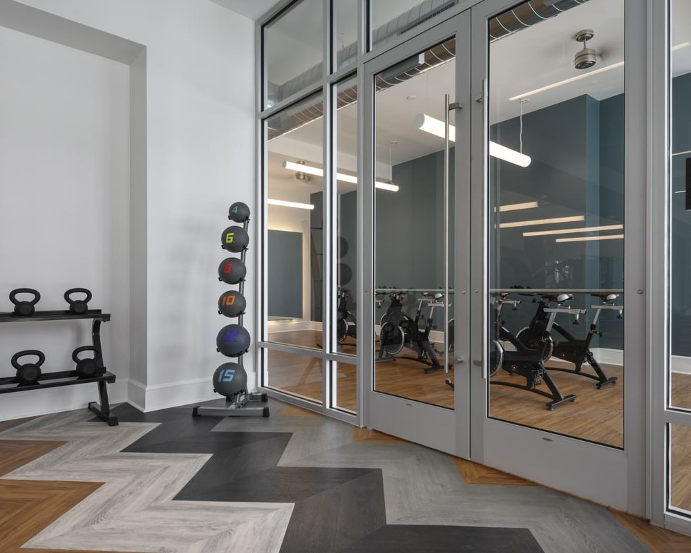 Apartments Denver CO - DECO Apartments Cycling Room With Cardio Machines and Free Weights