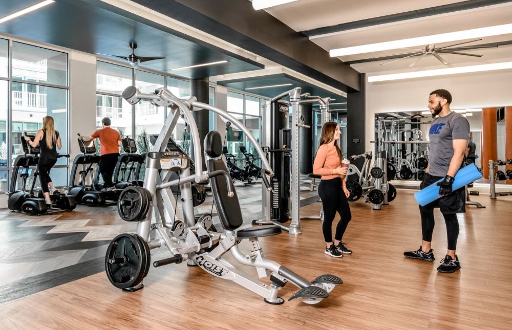Luxury Apartments in Denver for Rent - DECO Apartments Fitness Center With Floor to Ceiling Mirrors and Weight Machines